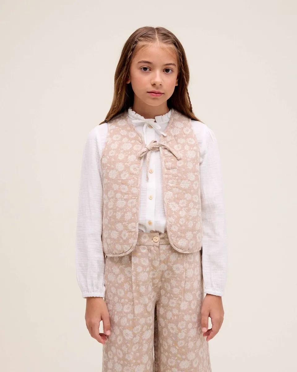 Жилет для девочки с цветочным принтом и деталью в виде бантика Dadati, бежевый/белый
Жилет для девочки с цветочным принтом и деталью в виде бантика Dadati, бежевый/белый