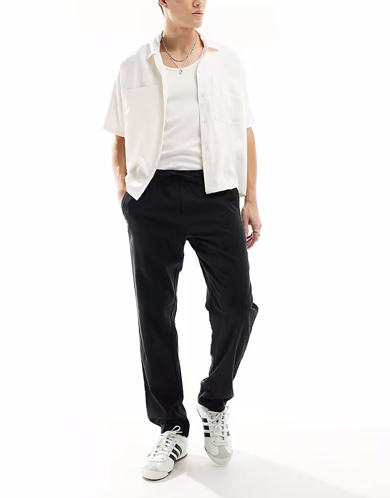 Брюки JJ Rebel из смеси льна и ткани на завязках черного цвета
Брюки JJ Rebel из смеси льна и ткани на завязках черного цвета