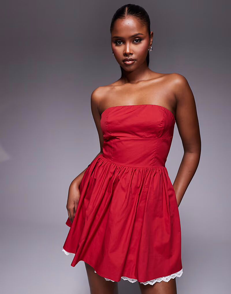 Эксклюзивное мини-платье-бандо Kaiia из поплина с контрастным кружевным подолом в красно-белом цвете
Эксклюзивное мини-платье-бандо Kaiia из поплина с контрастным кружевным подолом в красно-белом цвете