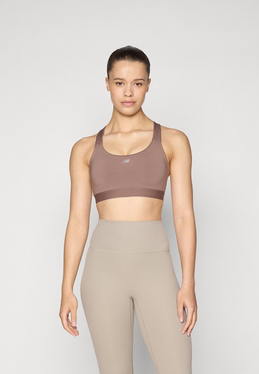 Бюстгальтер New Balance Medium support sports bra, Earth Shadow/Brown
Бюстгальтер New Balance Medium support sports bra, Earth Shadow/Brown