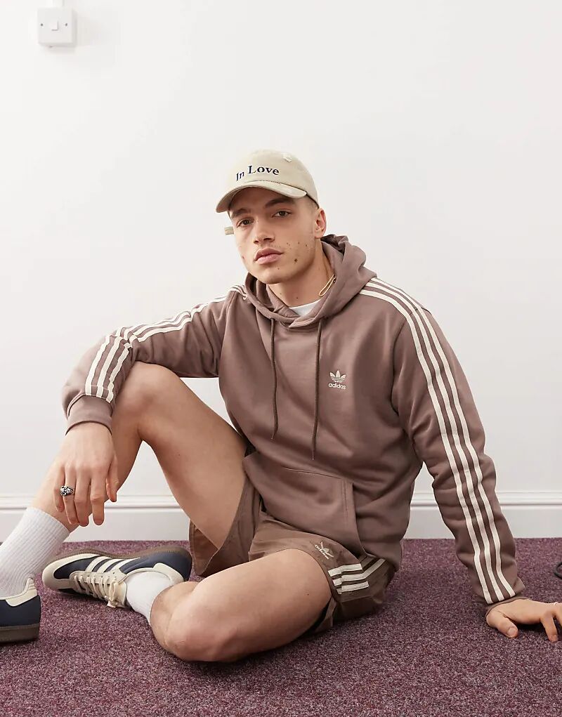 Толстовка с капюшоном Adicolor Classics 3-Stripes коричневого цвета adidas Originals
Толстовка с капюшоном Adicolor Classics 3-Stripes коричневого цвета adidas Originals