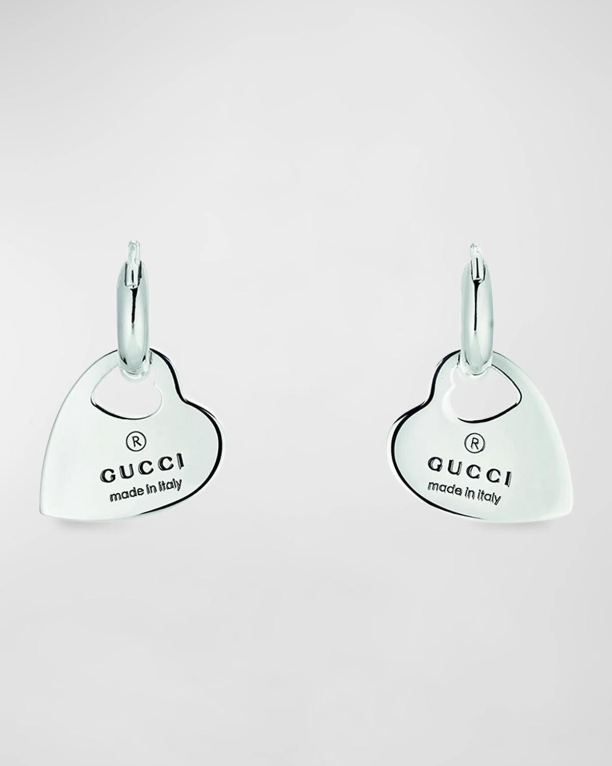 Серьги-кольца с подвеской в форме сердца торговой марки Gucci
Серьги-кольца с подвеской в форме сердца торговой марки Gucci
