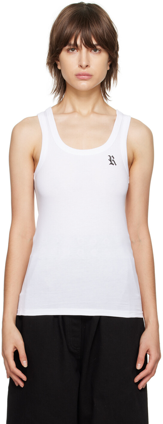 Белая майка с нашивками Raf Simons
Белая майка с нашивками Raf Simons