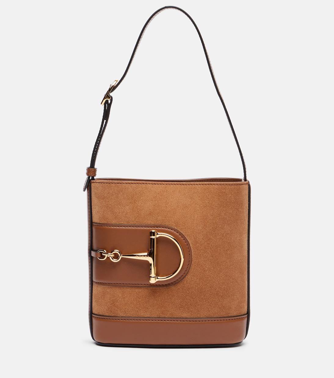 73 Мини кожаная сумка-ведро Gucci, Sundial/Sundial
73 Мини кожаная сумка-ведро Gucci, Sundial/Sundial