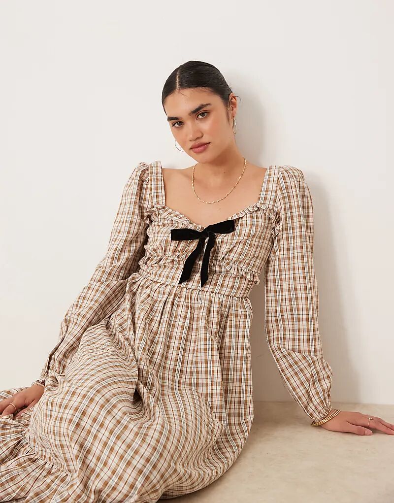 Гламурное платье макси с длинными рукавами и завязкой спереди в коричневую клетку
Гламурное платье макси с длинными рукавами и завязкой спереди в коричневую клетку