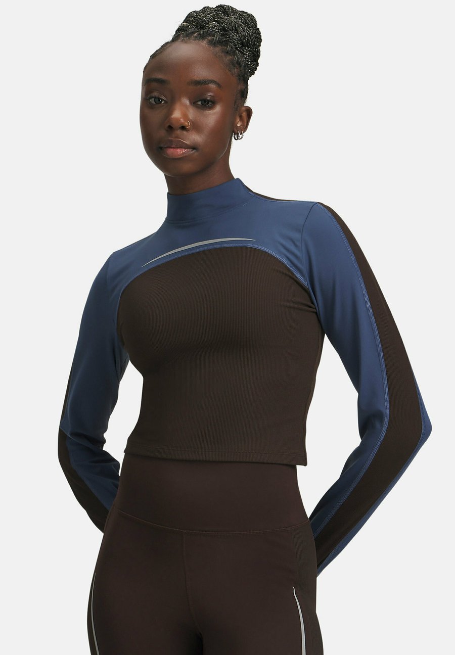 Топ Under Armour Halo Cold Weather, Kona Brown/Brown
Топ Under Armour Halo Cold Weather, Kona Brown/Brown
