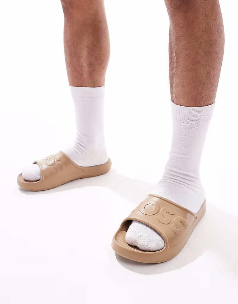 Формованные шлепанцы с тисненым логотипом BOSS Dario в коричневом цвете BOSS Orange
Формованные шлепанцы с тисненым логотипом BOSS Dario в коричневом цвете BOSS Orange