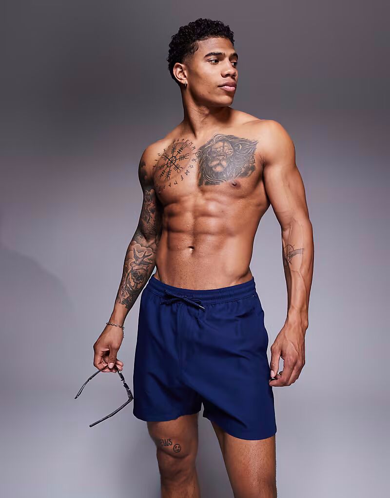 Плавки-шорты ASOS DESIGN средней длины темно-синего цвета
Плавки-шорты ASOS DESIGN средней длины темно-синего цвета