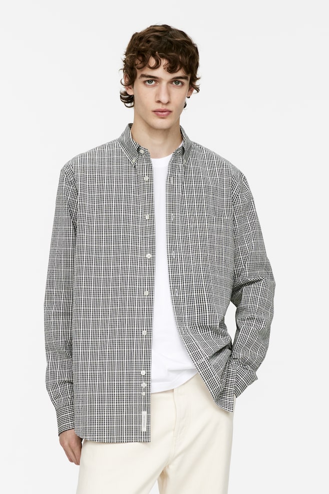 Рубашка свободного кроя из сирсакера Arket, черный
Рубашка свободного кроя из сирсакера Arket, черный