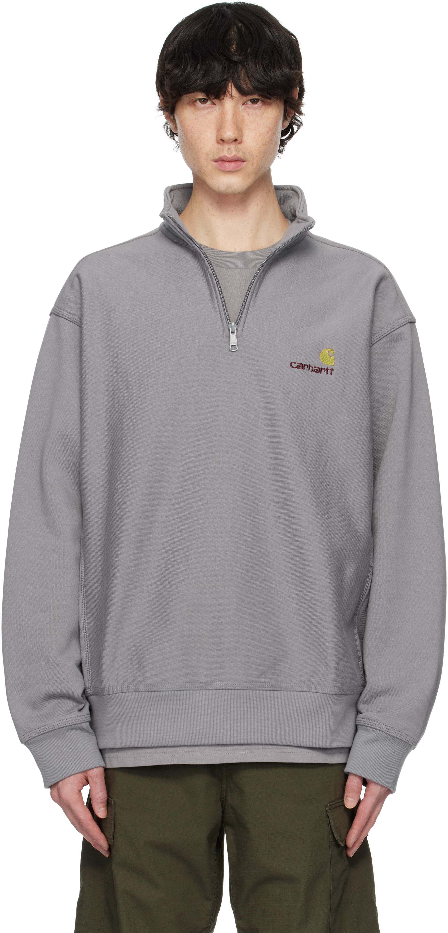 Серая толстовка с надписью American Script и застежкой-молнией на половину длины Carhartt Work In Progress 
Серая толстовка с надписью American Script и застежкой-молнией на половину длины Carhartt Work In Progress