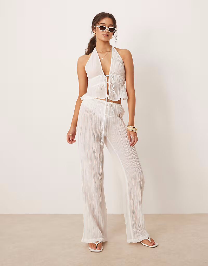 Брюки из рами с жатым поясом и завязкой, белые Mango
Брюки из рами с жатым поясом и завязкой, белые Mango