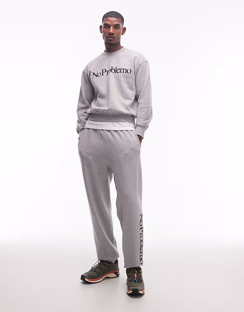 Хлопковые брюки-джоггеры с логотипом серого меланжевого цвета No Problemo
Хлопковые брюки-джоггеры с логотипом серого меланжевого цвета No Problemo