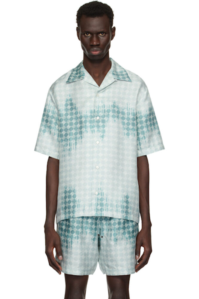 Синяя выбеленная рубашка «MA» для похода AMIRI
Синяя выбеленная рубашка «MA» для похода AMIRI