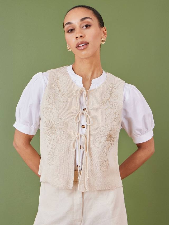 Жилет с цветочным вязаным галстуком спереди Yumi, бежевый
Жилет с цветочным вязаным галстуком спереди Yumi, бежевый