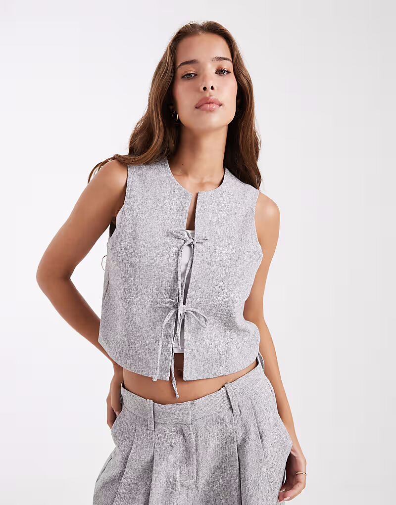 Жилет, приталенный и с завязкой спереди, серый меланж Vero Moda
Жилет, приталенный и с завязкой спереди, серый меланж Vero Moda