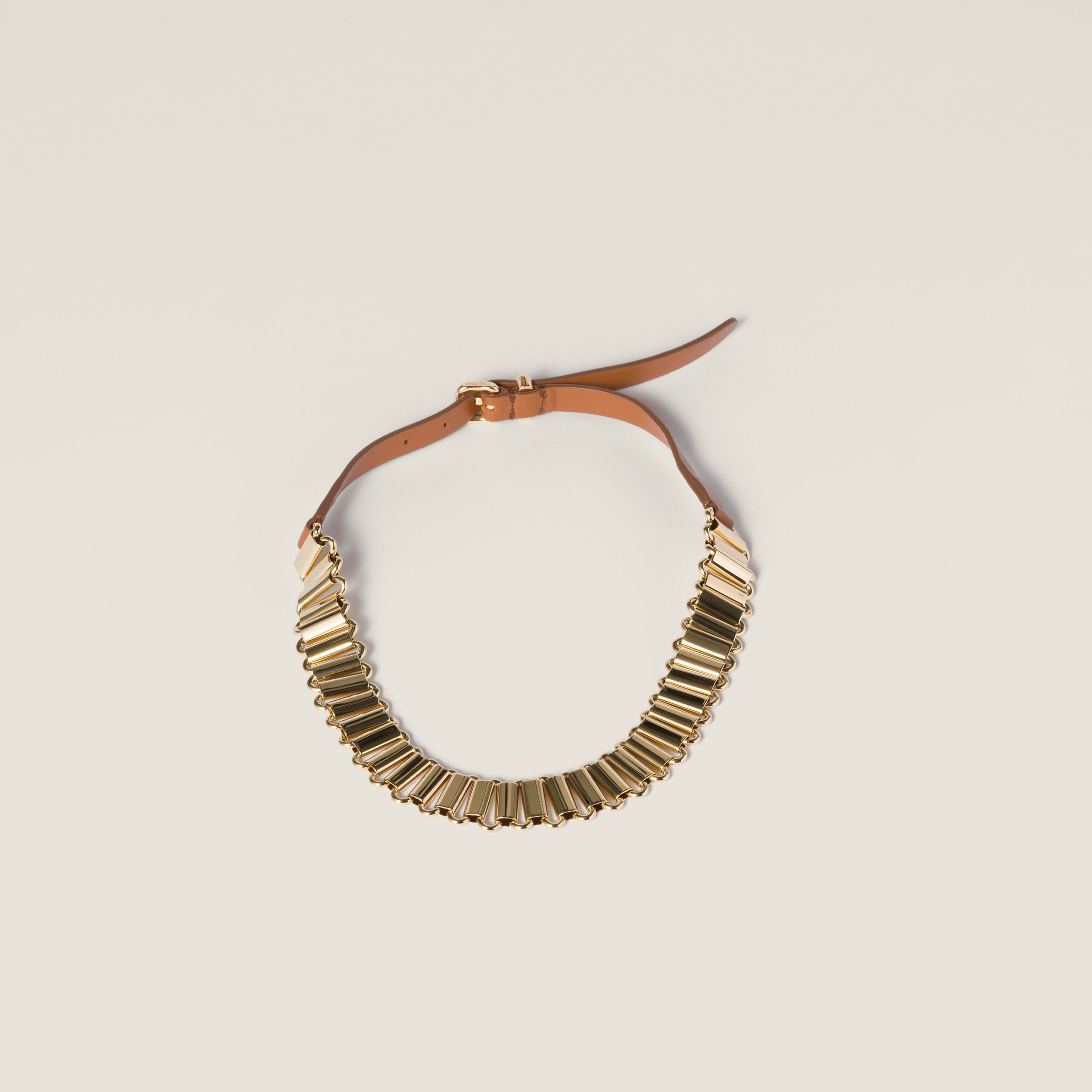 Ожерелье из металла и кожи MIU MIU, золото/коньяк
Ожерелье из металла и кожи MIU MIU, золото/коньяк