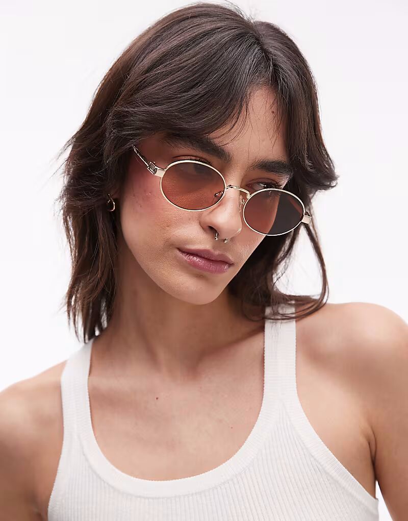 Солнцезащитные очки Le Specs Poseidon Deux в круглой металлической оправе золотого и коричневого цвета
Солнцезащитные очки Le Specs Poseidon Deux в круглой металлической оправе золотого и коричневого цвета