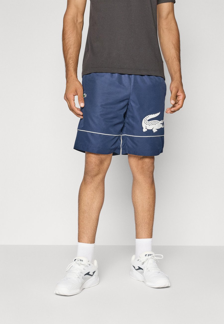 Спортивные шорты Lacoste Sport Sports shorts, Navy Blue/Flour/Dark Blue
Спортивные шорты Lacoste Sport Sports shorts, Navy Blue/Flour/Dark Blue