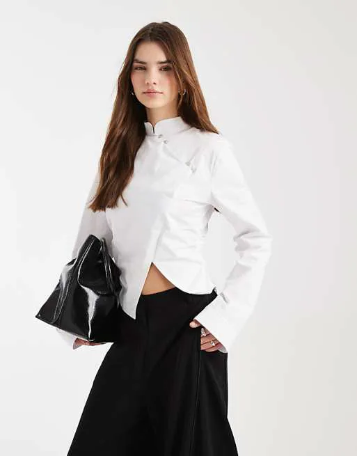Белая приталенная рубашка с воротником-стойкой и завязками ASOS DESIGN
Белая приталенная рубашка с воротником-стойкой и завязками ASOS DESIGN