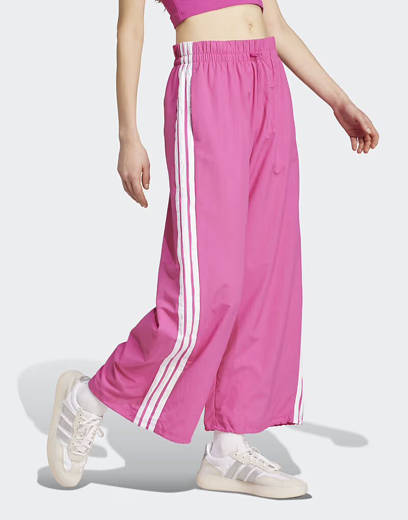 Парашютные брюки Adidas performance Essentials с тремя полосками в стиле лайфстайл в полупрозрачном цвете фуксия/белый
Парашютные брюки Adidas performance Essentials с тремя полосками в стиле лайфстайл в полупрозрачном цвете фуксия/белый