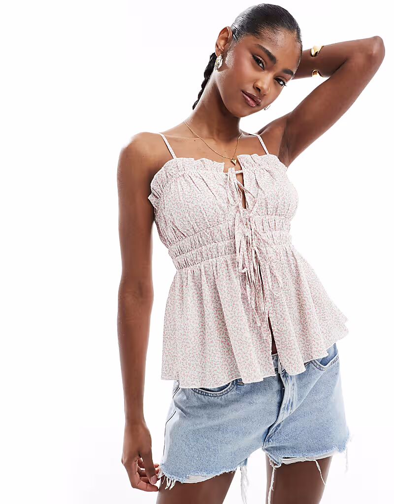 Топ Stradivarius STR на бретелях с завязками спереди и цветочным принтом
Топ Stradivarius STR на бретелях с завязками спереди и цветочным принтом