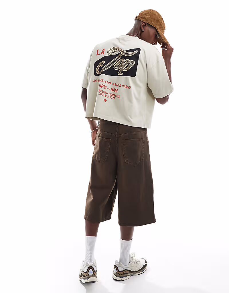 Укороченная футболка свободного кроя с изображением города бежевого цвета от ASOS DESIGN
Укороченная футболка свободного кроя с изображением города бежевого цвета от ASOS DESIGN