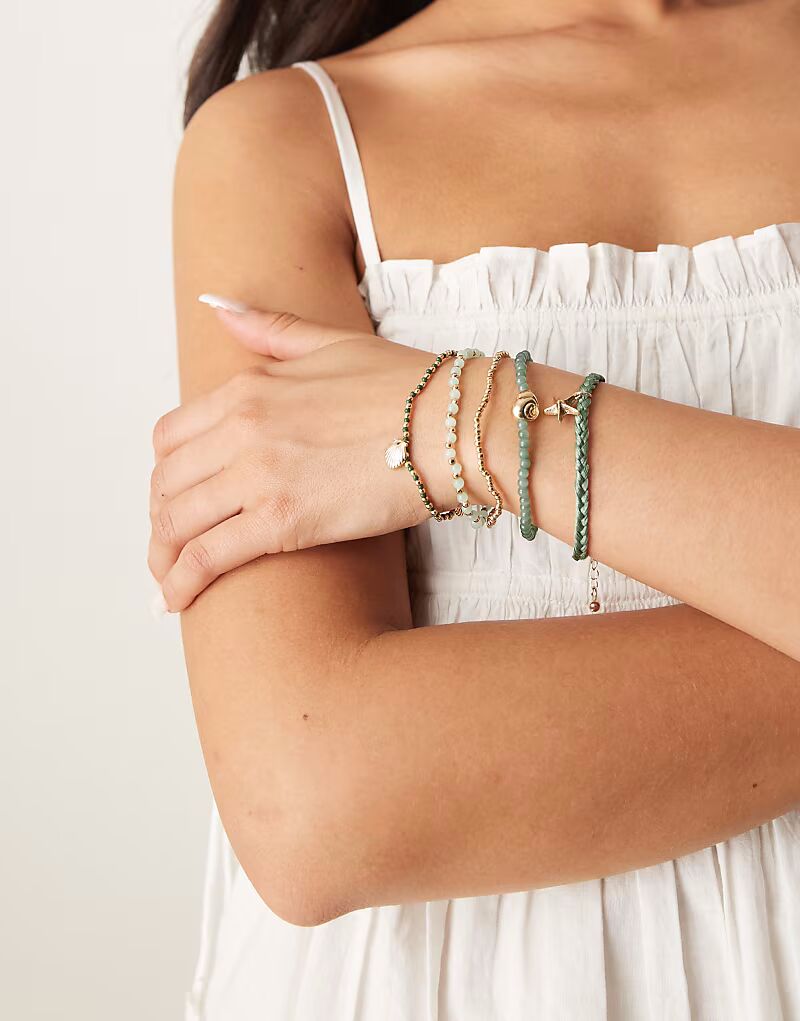 Многорядный браслет в форме ракушки золотистого оттенка Asos Design
Многорядный браслет в форме ракушки золотистого оттенка Asos Design