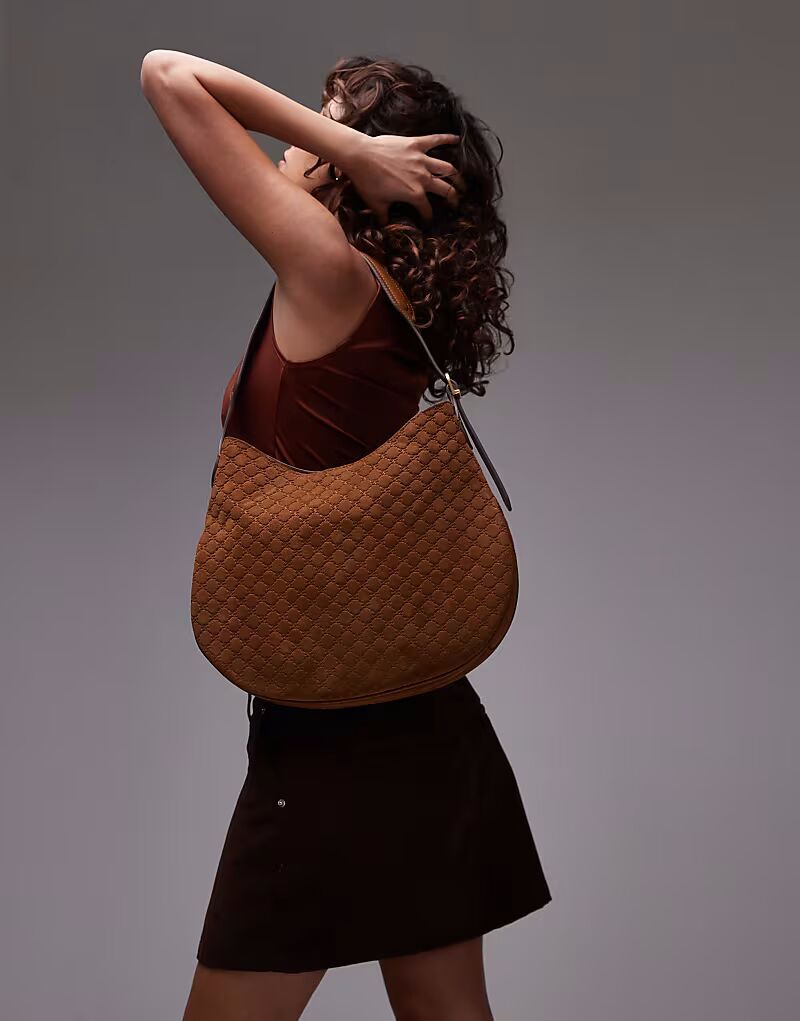 Сумка из коричневой кожи с тисненой монограммой Mango
Сумка из коричневой кожи с тисненой монограммой Mango