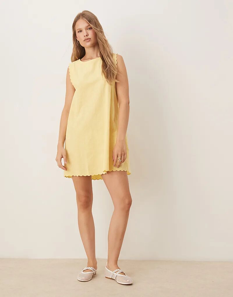Мини-платье Vila из хлопка с фестончатой каймой желтого цвета
Мини-платье Vila из хлопка с фестончатой каймой желтого цвета