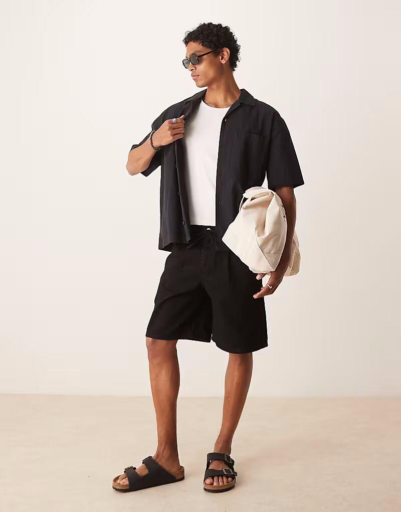 Широкие джинсовые шорты средней длины ASOS DESIGN с завязками спереди черного цвета
Широкие джинсовые шорты средней длины ASOS DESIGN с завязками спереди черного цвета