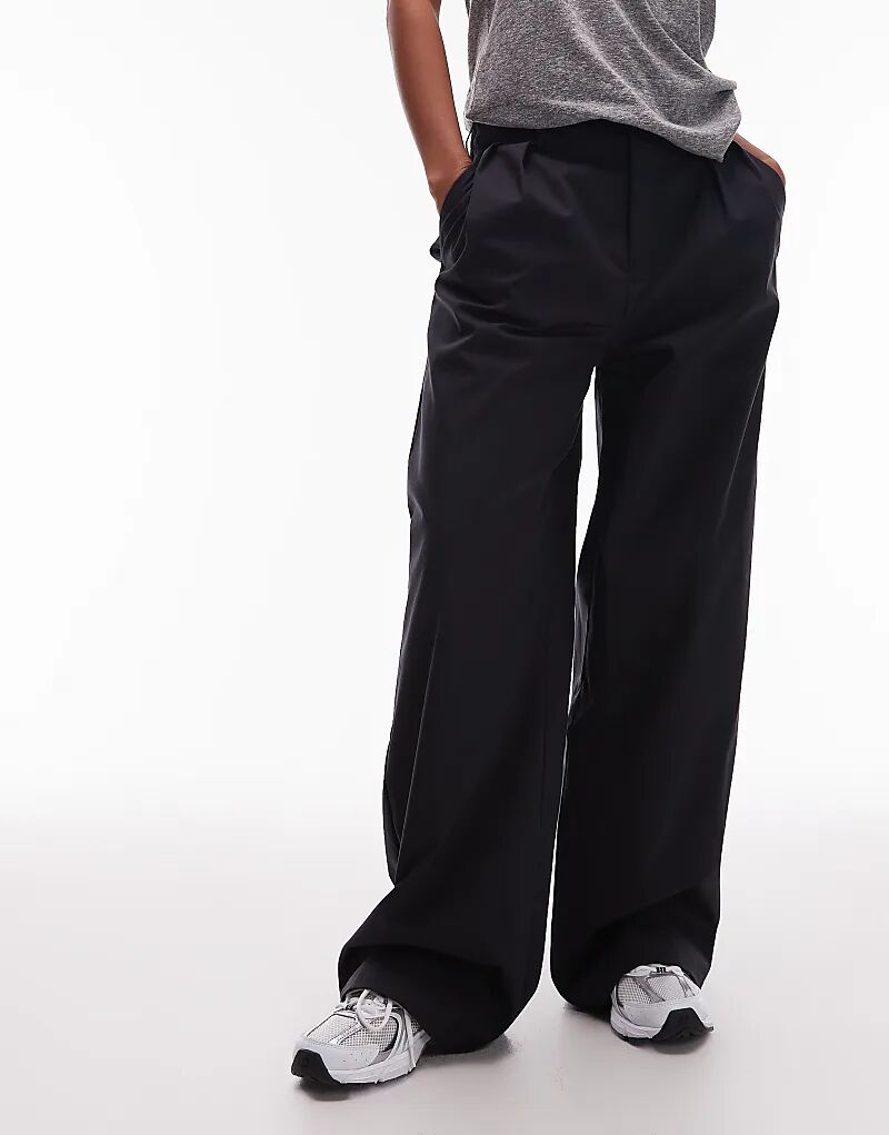 Брюки New Balance Boylston из твила черного цвета
Брюки New Balance Boylston из твила черного цвета