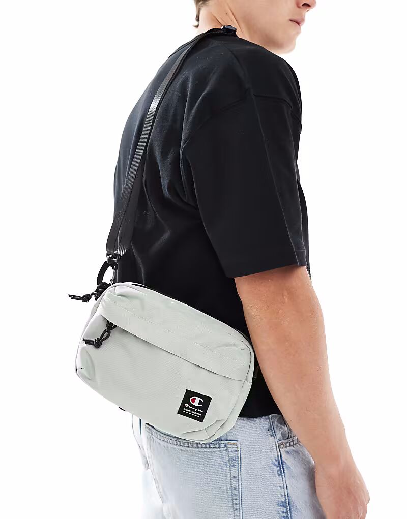 Маленькая сумка через плечо Champion серого цвета
Маленькая сумка через плечо Champion серого цвета