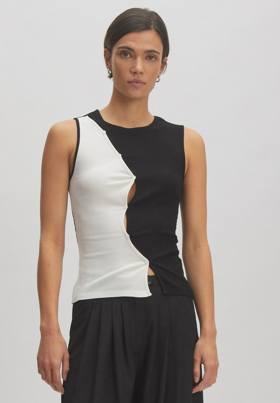 Топ EDITED KAIA, Weiß Schwarz/White
Топ EDITED KAIA, Weiß Schwarz/White