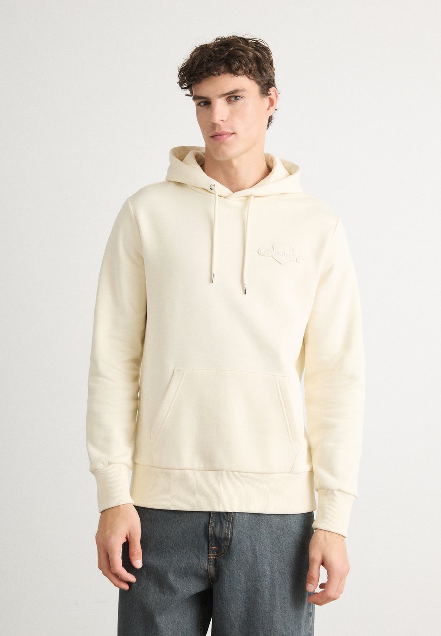 Худи GANT TONAL SHIELD HOODIE, Cream/Off-White
Худи GANT TONAL SHIELD HOODIE, Cream/Off-White
