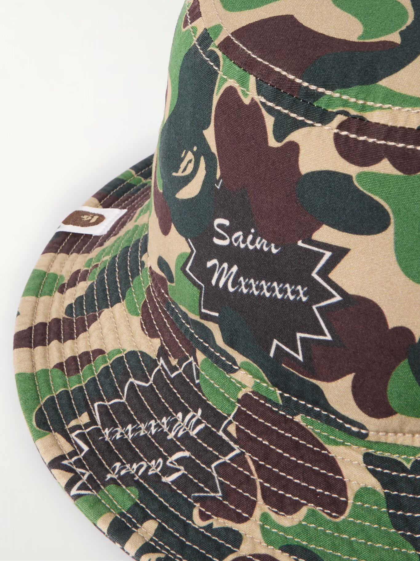 Хлопковая панама с камуфляжным принтом и логотипом Bathing Ape SAINT MXXXXXX, зеленый
Хлопковая панама с камуфляжным принтом и логотипом Bathing Ape SAINT MXXXXXX, зеленый