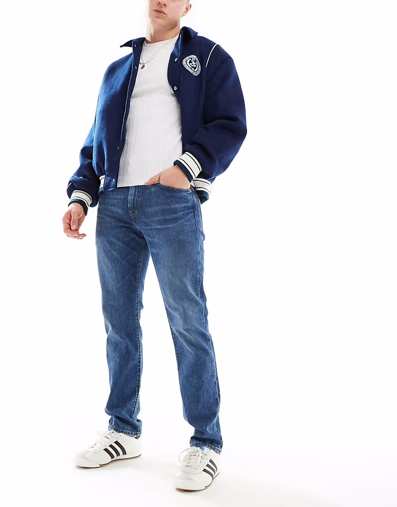 Зауженные джинсы 502 средне-синего цвета Levi'S
Зауженные джинсы 502 средне-синего цвета Levi'S