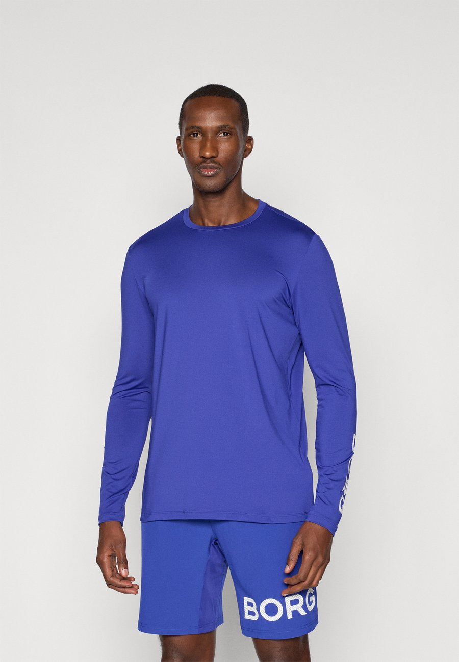 Топ Björn Borg LONG SLEEVE, Clematis Blue/Royal Blue
Топ Björn Borg LONG SLEEVE, Clematis Blue/Royal Blue