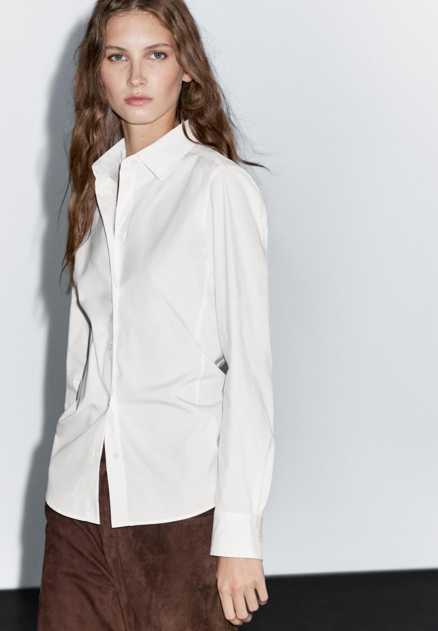 Блуза Massimo Dutti STRETCH FITTED LONG SLEEVE, White
Блуза Massimo Dutti STRETCH FITTED LONG SLEEVE, White