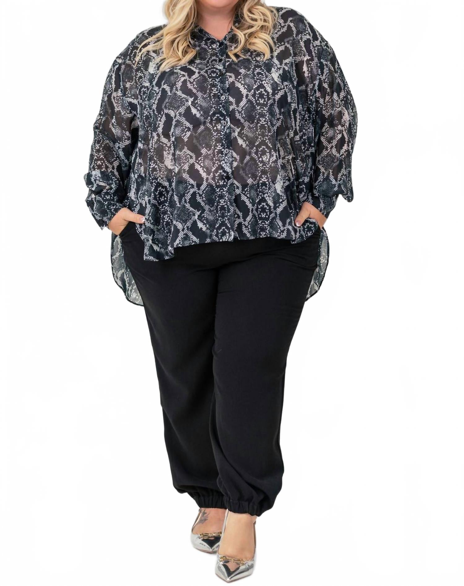 Черные расклешенные брюки с манжетами плюс сайз Karen Kane
Черные расклешенные брюки с манжетами плюс сайз Karen Kane