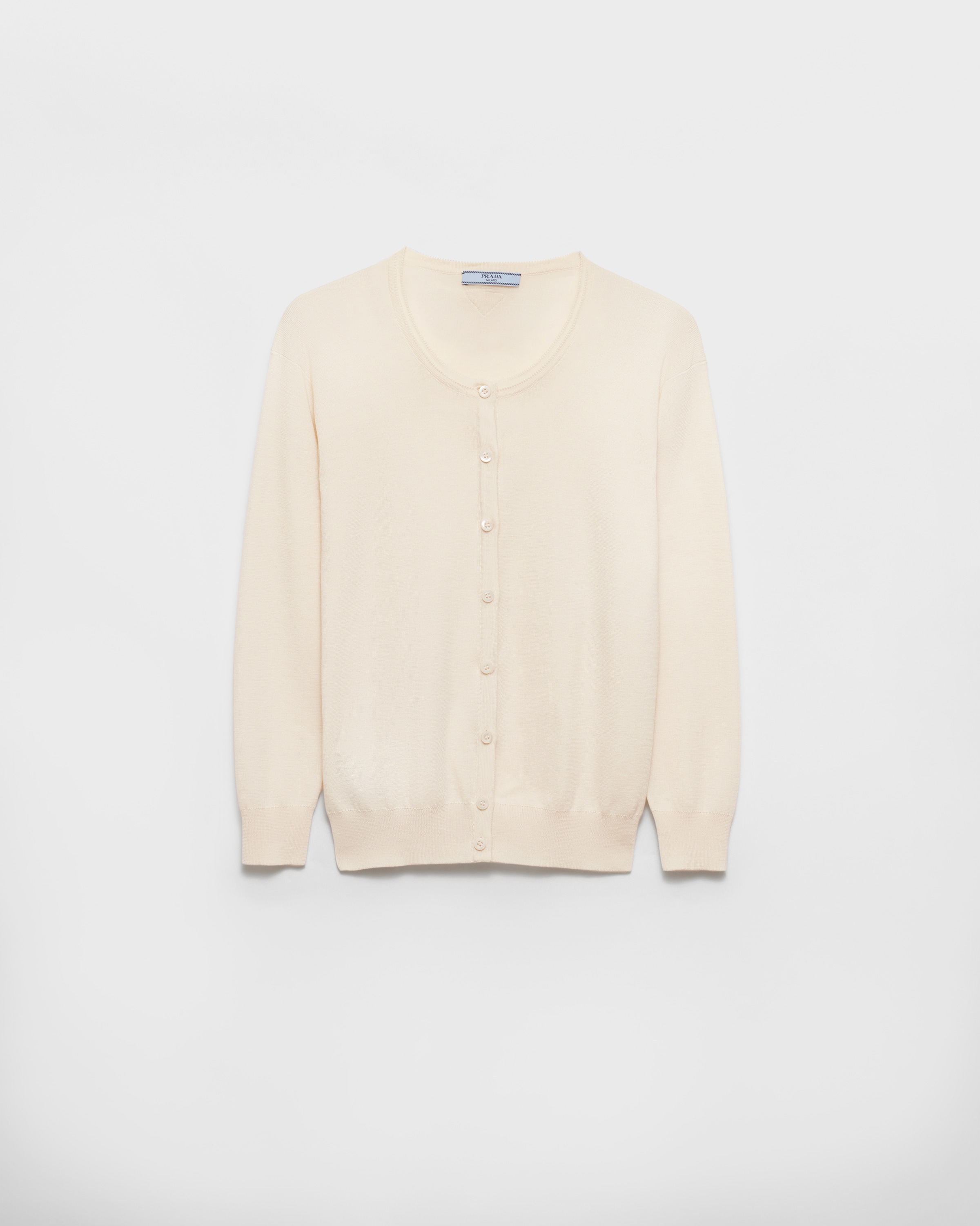 Вязаный кардиган из хлопка и шелка Prada, бежевый
Вязаный кардиган из хлопка и шелка Prada, бежевый