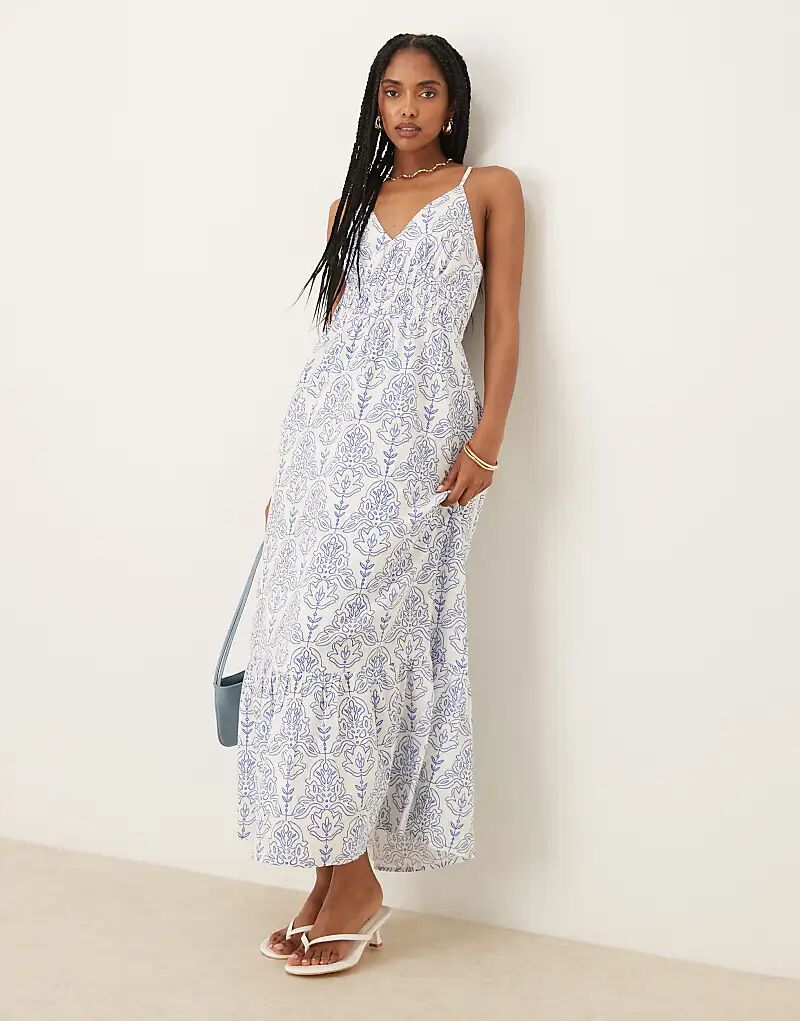 Платье-макси YAS с перекрещивающимися бретелями на спине с сине-белым плиточным принтом
Платье-макси YAS с перекрещивающимися бретелями на спине с сине-белым плиточным принтом