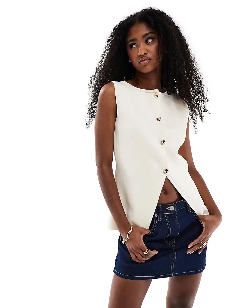 Жилет ASOS DESIGN с золотыми пуговицами спереди цвета экрю
Жилет ASOS DESIGN с золотыми пуговицами спереди цвета экрю