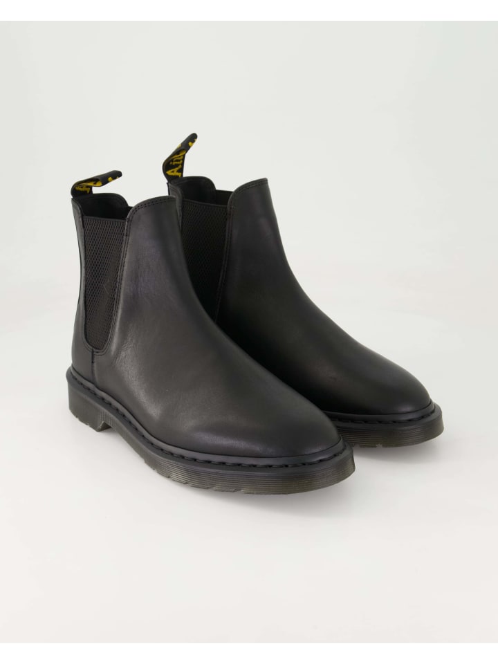 Черные ботильоны Dr. Martens
Черные ботильоны Dr. Martens