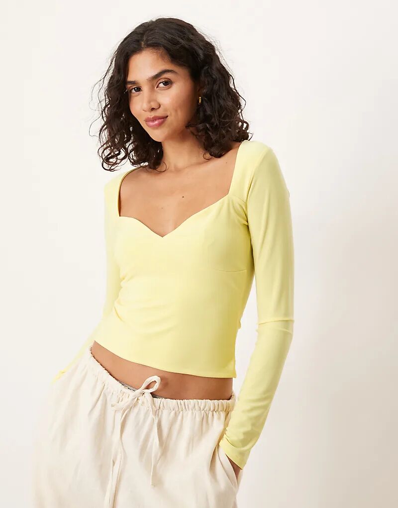 Обтягивающий топ с длинными рукавами и отделкой в виде сердца ASOS DESIGN желтого цвета
Обтягивающий топ с длинными рукавами и отделкой в виде сердца ASOS DESIGN желтого цвета