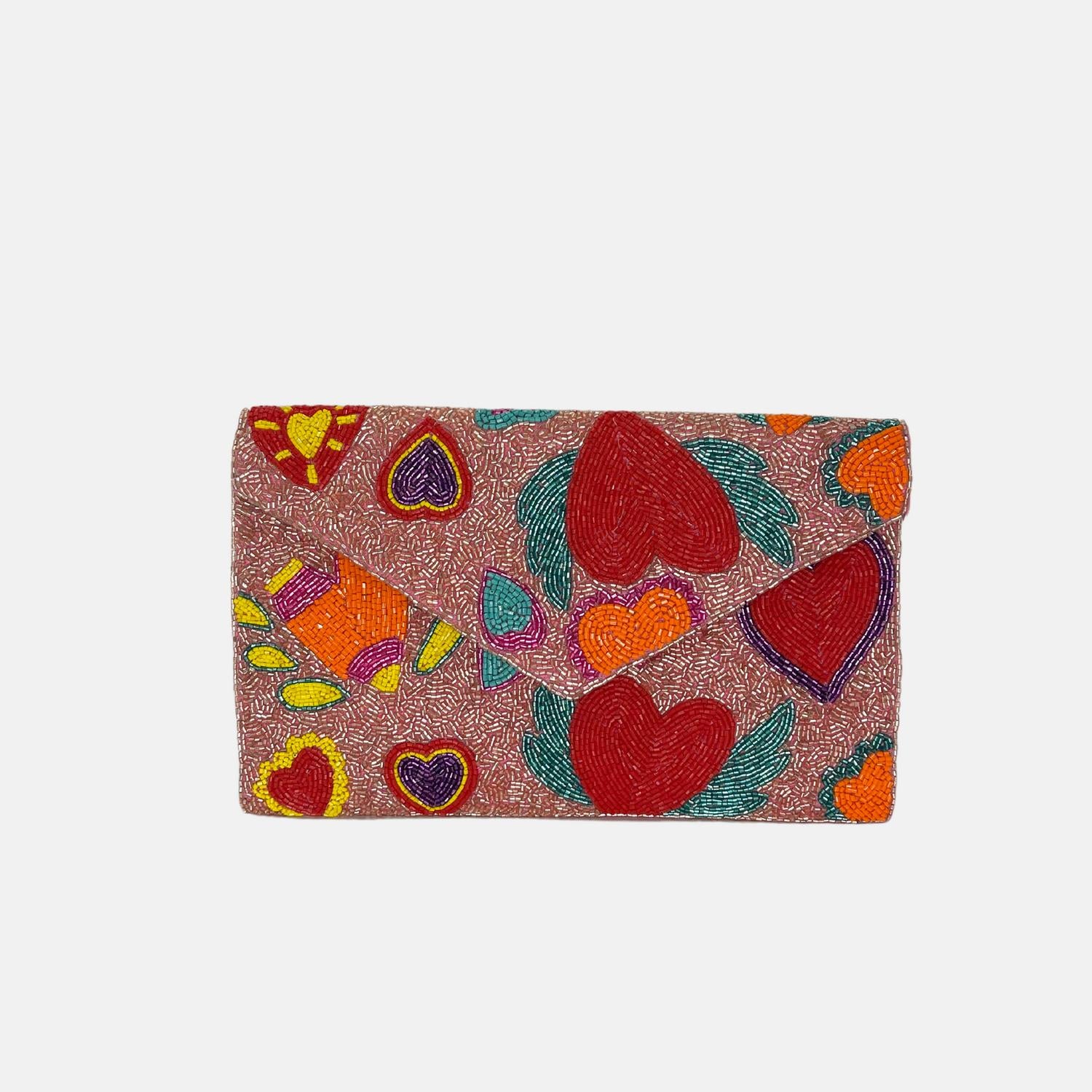 Женская клатч-сумка с крыльями и сердцем в розовом цвете Treasure Jewels
Женская клатч-сумка с крыльями и сердцем в розовом цвете Treasure Jewels