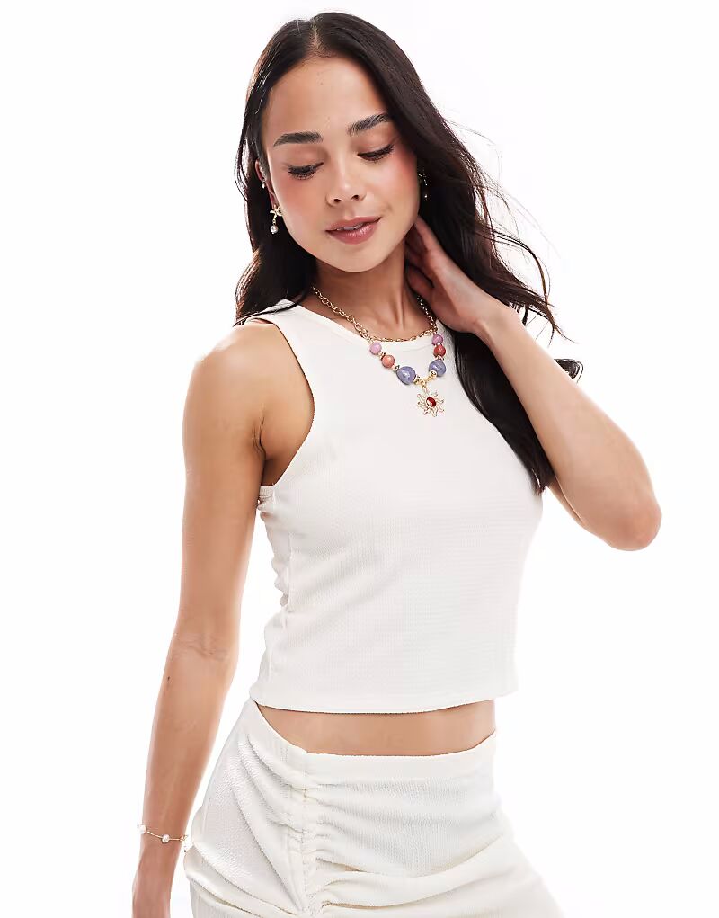 Укороченный пляжный топ Vero Moda из текстурированного джерси белого цвета
Укороченный пляжный топ Vero Moda из текстурированного джерси белого цвета