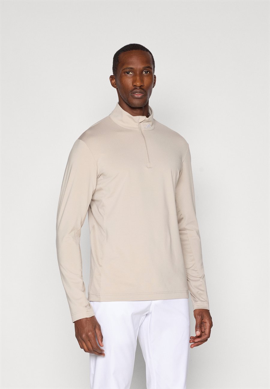 Топ J.LINDEBERG Sports TOUR TECH MID LAYER, String/Beige
Топ J.LINDEBERG Sports TOUR TECH MID LAYER, String/Beige