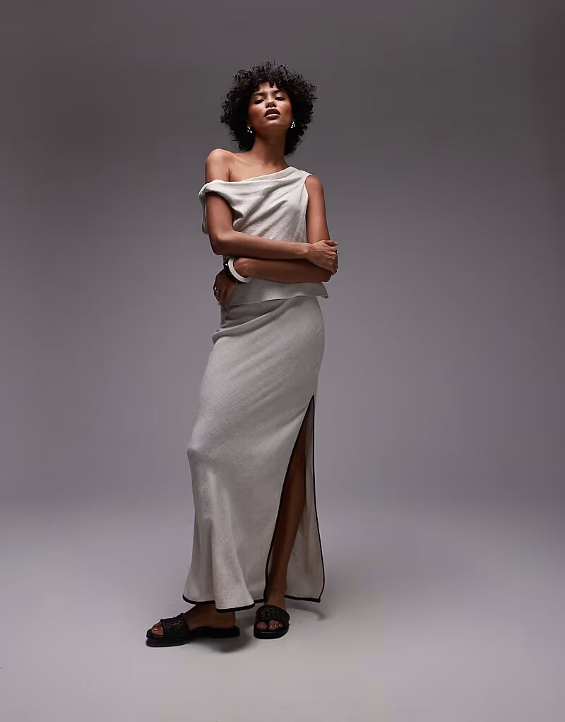 Юбка макси из льна Topshop в натуральном цвете с черной окантовкой
Юбка макси из льна Topshop в натуральном цвете с черной окантовкой