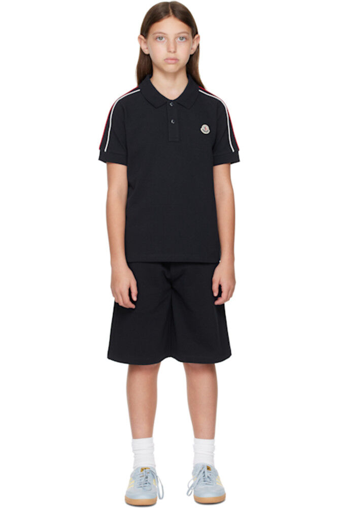 Комплект из хлопкового поло и шорт с трехцветной отделкой для больших детей Moncler Enfant
Комплект из хлопкового поло и шорт с трехцветной отделкой для больших детей Moncler Enfant