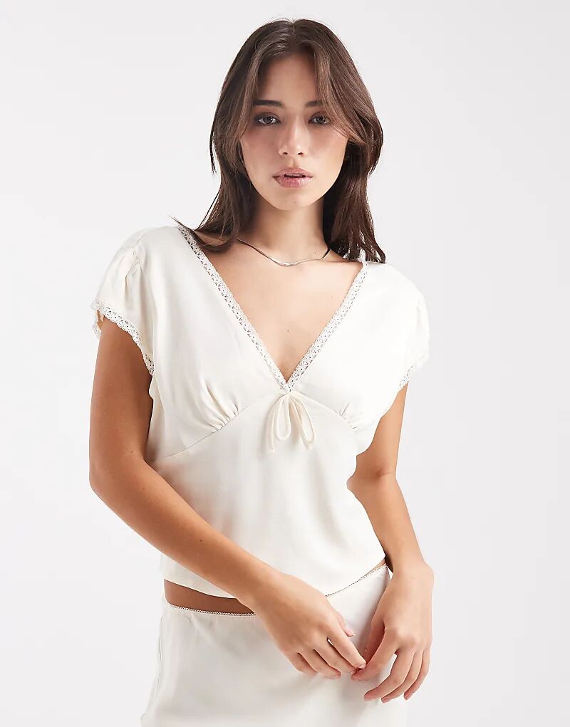 Блузка цвета слоновой кости с кружевной отделкой от ASOS DESIGN
Блузка цвета слоновой кости с кружевной отделкой от ASOS DESIGN